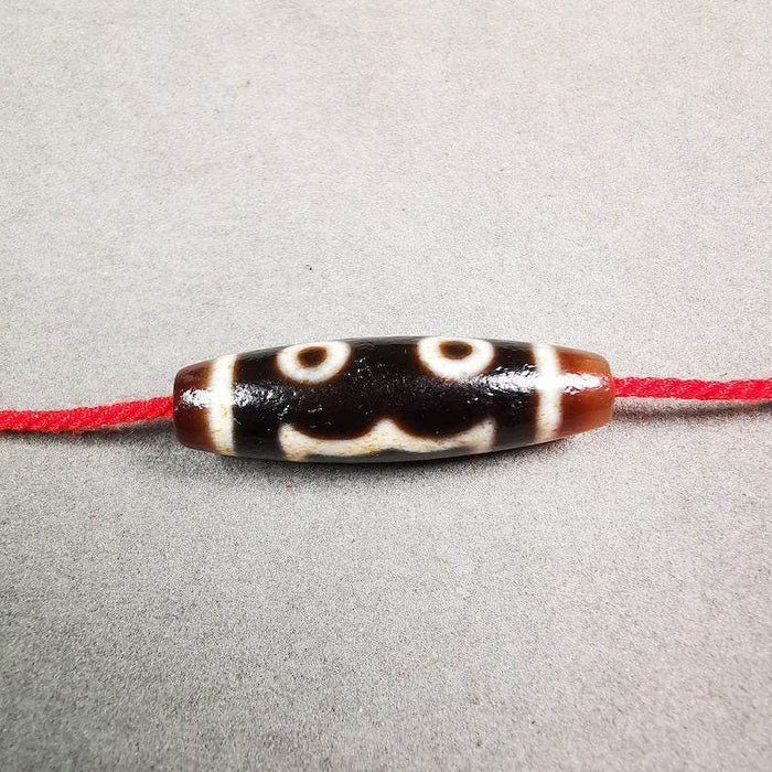 3 Eyed Dzi Bead - Tibetan dzi bead, front view