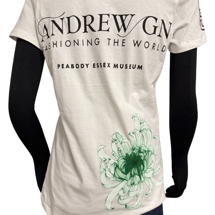 White t-shirt with green floral design and text on a white background