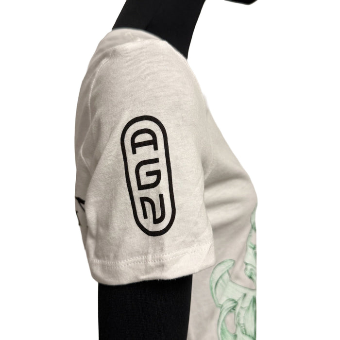 White long-sleeve shirt with black logo on sleeve and green design on front, worn by a mannequin.