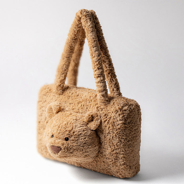 Teddy bear-shaped handbag on a light gray background