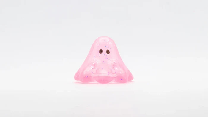 BOO CLEAR PINK GLITTER: A 2cm soft vinyl figure with a playful blob shape, glittery pink translucence, and dark eyes, embodying Strangecat Toys' whimsical art toy style.