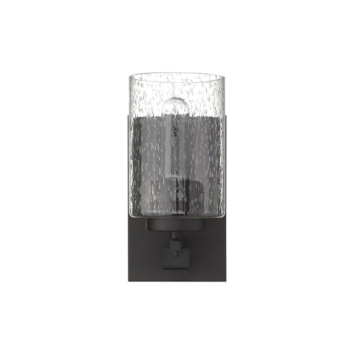 Front view of the Bronze metal wall sconce with clear seeded glass shade – modern indoor wall lighting fixture.