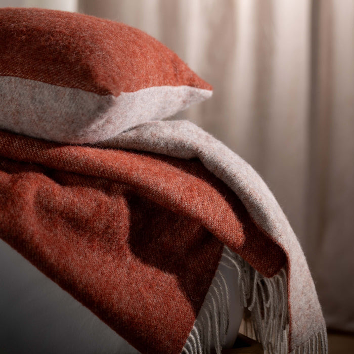 Burnt Orange Reversible Pure Wool Throw - linen, styled in a bedroom | Soak and Sleep