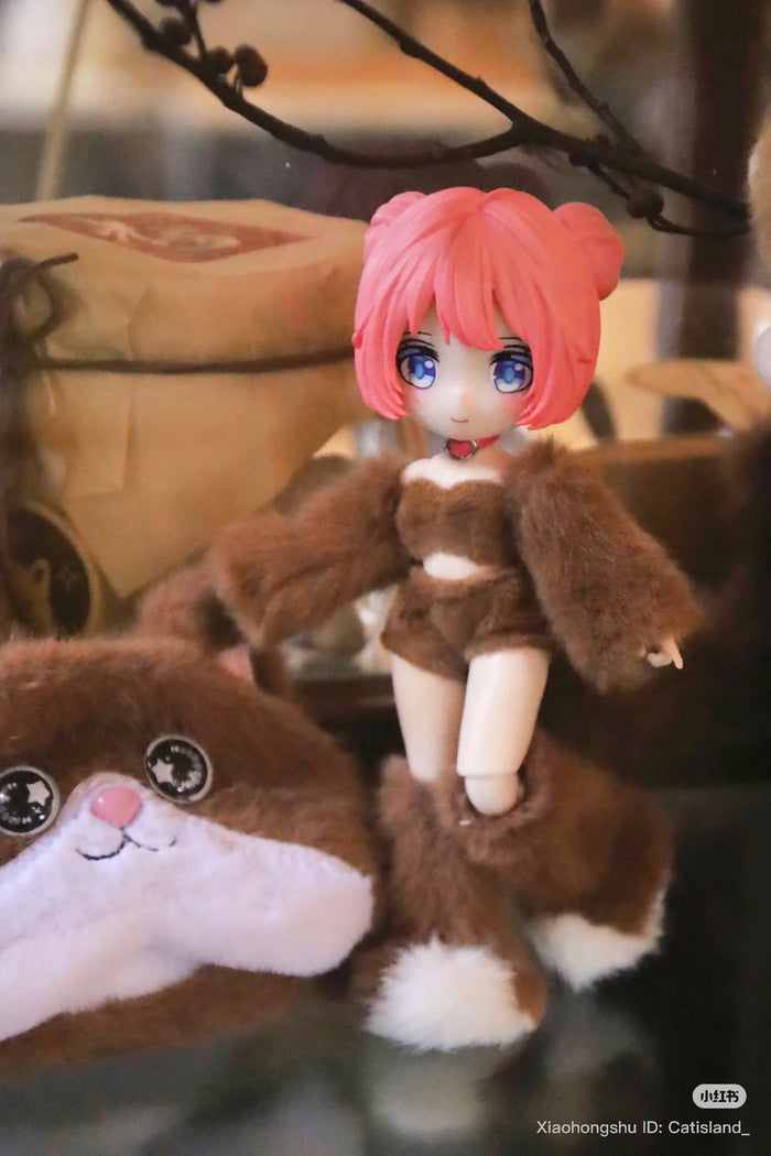 Anime-style figurine with pink hair in a brown furry outfit, paired with a matching plush pouch, from Cat Island-Black Cat Or Candy Cat Series Articulated Figure Blind Box.