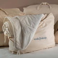 Cotton Storage Bags styled in a bedroom | Soak and Sleep