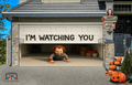 Crawl of Chucky garage door cover featuring creepy doll and chilling message 'I'M WATCHING YOU' for Halloween decor.