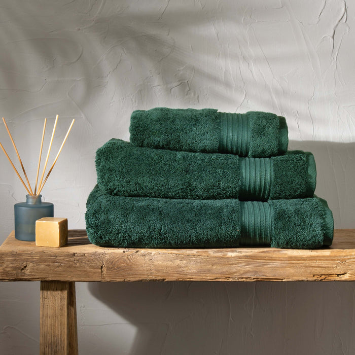 Dark Emerald Egyptian Cotton Towel Bale styled in a bedroom | Soak and Sleep