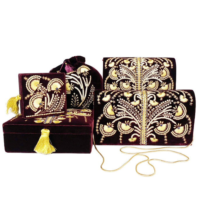 A collection of purple velvet boxes and bags with gold beading and embroidery.