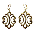 Pair of gold tone earrings with intricate designs on a white background