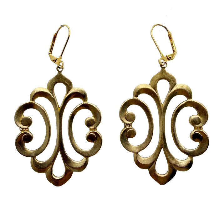 Pair of gold tone earrings with intricate designs on a white background