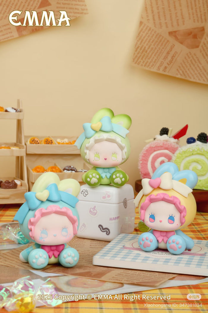 Emma Bunny Collector Mini Blind Box Series figurines, featuring kawaii-style faces and bunny-ear hoods, posed with toy pastries. Preorder for September 2025 release.