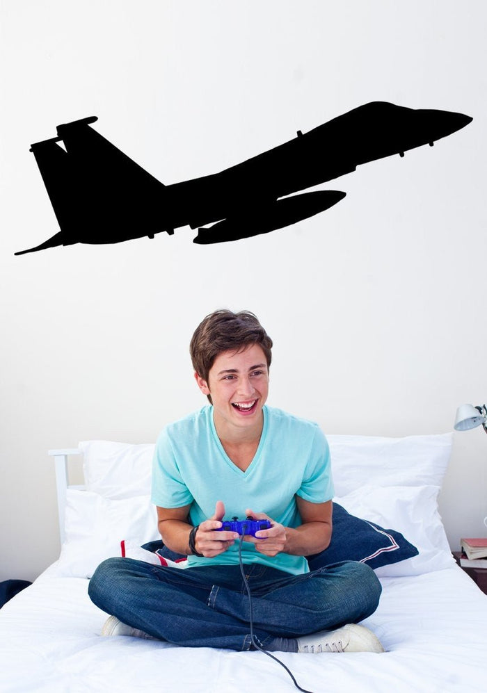 F-15E Strike Eagle military jet silhouette wall decal displayed above a bedroom wall