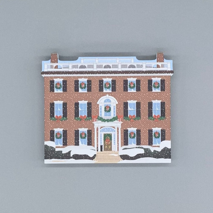 A wood block of The Andrew-Safford House decorated for the holidays.