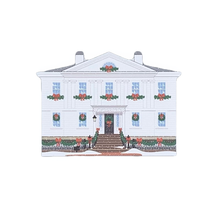 Decorative wood block of the Cotting-Smith Assembly House decorated for the holidays.