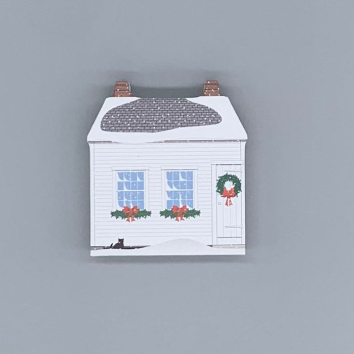 Decorative wood block of the Lye-Tapley Shoe Shop decorated for the holidays.