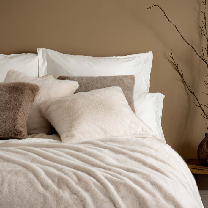 Ivory Faux Fur Cushions - winter, double, styled in a bedroom | Soak and Sleep