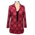 A pink floral applique jacket on a mannequin displaying an open front design with long sleeves.