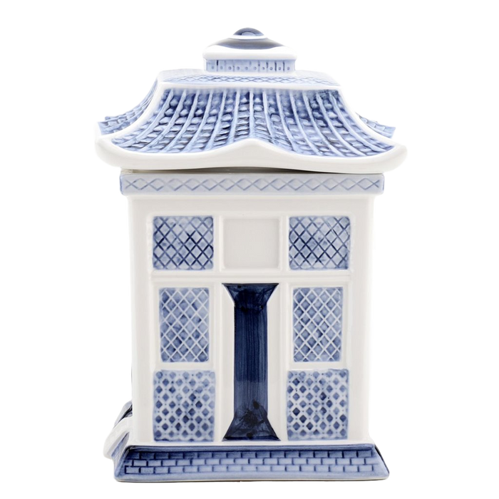 A blue and white porcelain lidded jar with a blue willow embossed design, resembling a traditional Asian pagoda style cookie jar.