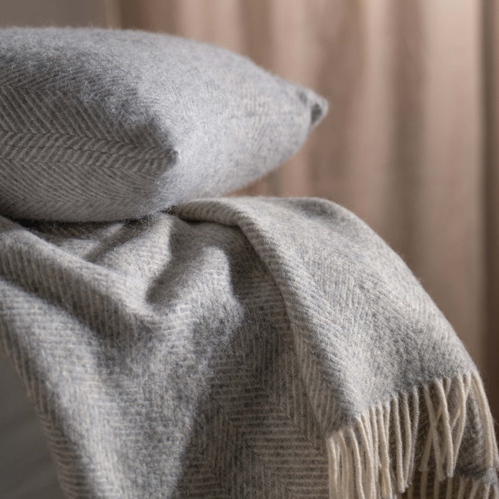 Light Grey Herringbone Pure Wool Throws & Cushions - mustard, styled in a bedroom 1 | Soak and Sleep