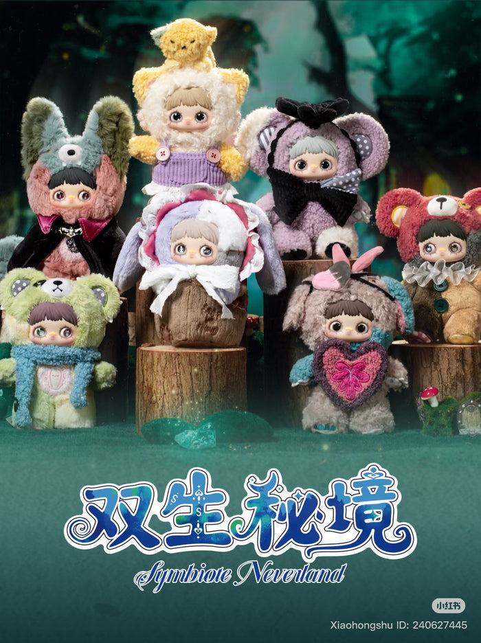 MayMei Symbiote Neverland Series Vinyl Keychain Plush Blind Box features eight dolls in animal costumes on tree-stump pedestals, set in an enchanted forest.
