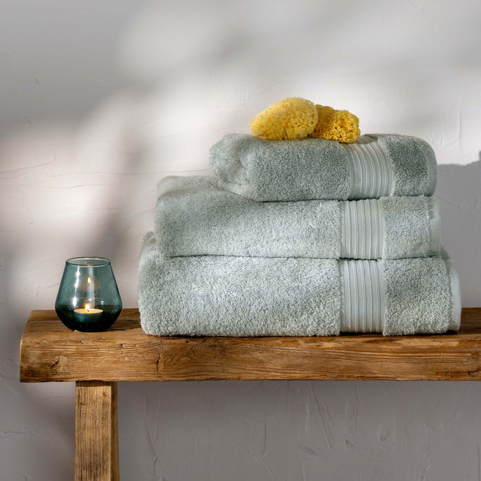 Mineral Blue Egyptian Cotton Towels styled in a bedroom | Soak and Sleep