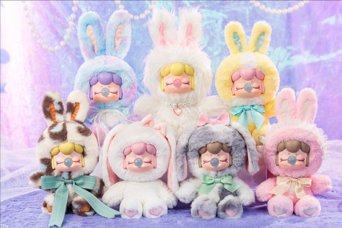 Nanci's Shining Bunny Plush Blind Box featuring a close-up of a smiling cartoon doll face, showcasing one of the seven collectible designs.