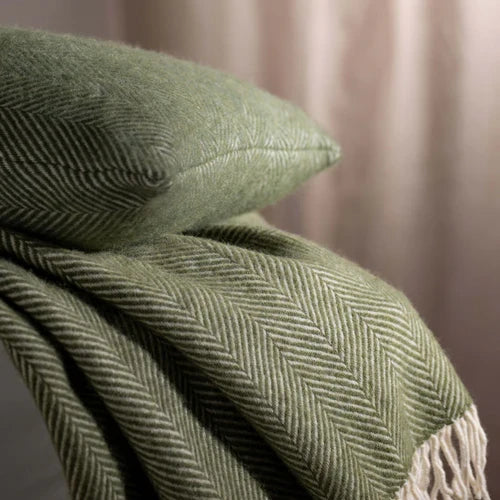 Olive Green Herringbone Pure Wool Throws & Cushions - mustard, styled in a bedroom | Soak and Sleep