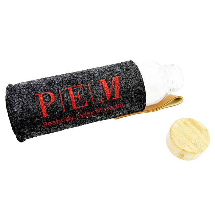 Grey cylindrical felt case with red text 'PEM' and a wooden object on a white background