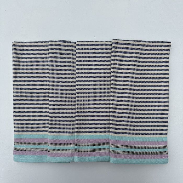 Set of four striped cotton napkins in shades of blue, gray, and beige, handwoven and laid out flat.