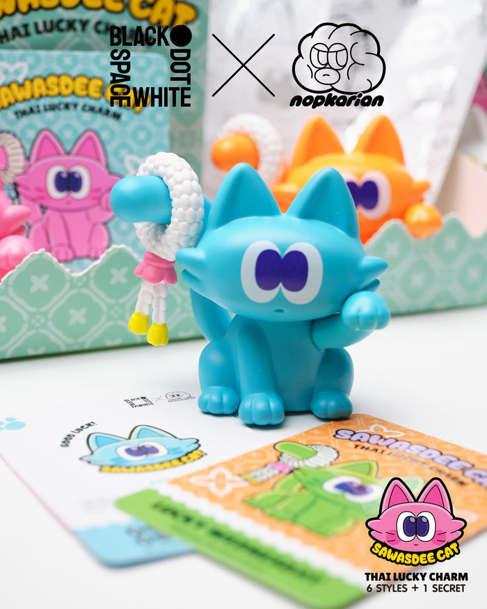 Sawasdee Cat Blind Box Series toy, featuring a blue cartoon cat holding a bracelet. Part of a collectible series with regular and secret designs.