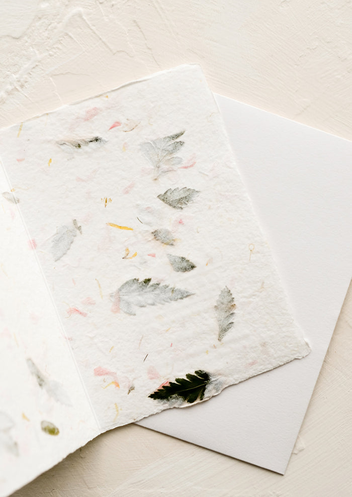 The blank inside of a greeting card made from handmade flower petal paper.