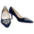 A pair of black velvet high-heeled shoes with dark grey rhinestone embellishments on the front, designed by Emma Hope.