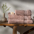 Soft Pink Egyptian Cotton Towels styled in a bedroom | Soak and Sleep