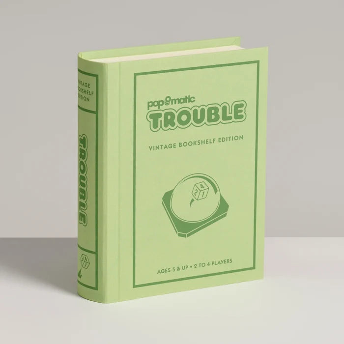 Green book-shaped product with 'papomatic Trouble' branding on a gray background