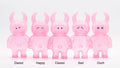 Five UAMOU CLEAR PINK GLITTER vinyl figures, 7cm tall, in varied expressions: Dazed, Happy, Classic, Sad, and Ouch. Made in Japan.