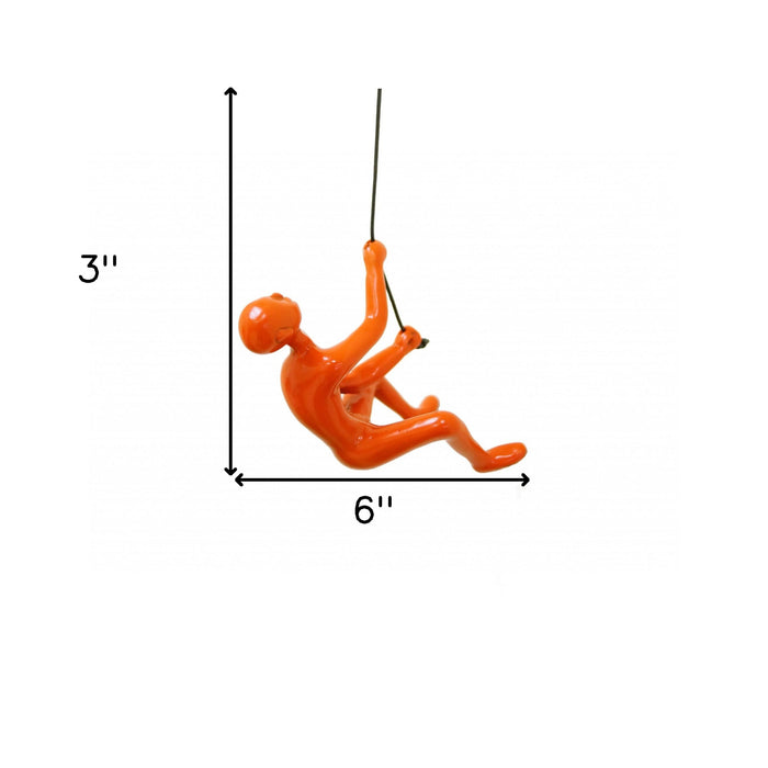 Unique Orange Climbing Man Wall Art | 3"x6"