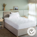 Waterproof Coolmax Pillow and Mattress Protectors styled in a bedroom | Soak and Sleep