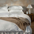 White Stonewashed Cotton Bed Set with Superking Pillowcases - linen, breathable, styled in a bedroom | Soak and Sleep