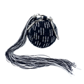 A black wristlet handbag with white stitched dashes and a removable black & white tassel, designed by Maya Luz.